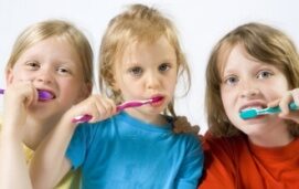 three-kids-girls-brushing-teeth-1961756